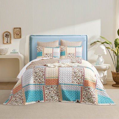 trending patchwork coverlet for your extra warmth layer displayed on the bed. the vibrant print kanes this treding coverlet most expensive bedding