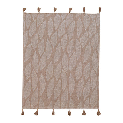 blanket throw, placed on the white tabel.